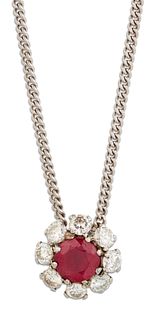 A RUBY AND DIAMOND CLUSTER PENDANT ON CHAIN, a round-cut ruby within a bord