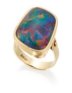 AN OPAL DOUBLET RING, an irregularly shaped opal doublet in a bezel setting