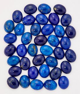 A GROUP OF LAPIS LAZULI OVAL CABOCHONS. (39) Measuring 10mm by 8mm approxim