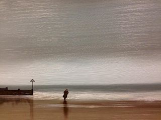 Lawrence Coulson (British, 20th Century), Solitary figure on a windswept beach, signed lower right "