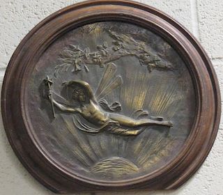 A framed bronze roundel of 'Ariel' signed A Spurrell, and with Shakespearean inscription on the reve