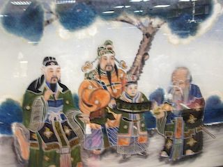 A pair of reverse glass paintings, one of the Shou, Lu, Fu trio and the other of figures on a terrac