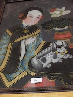 A reverse glass painting of a lady holding a lotus flower, a lion cub before her <br> <br>