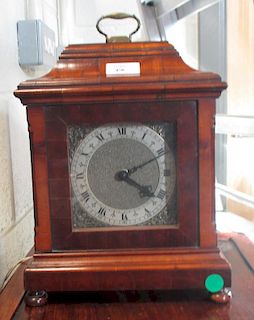 A walnut cased timepiece, 27cm high <br> <br>