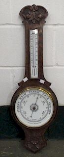 A carved oak banjo case aneroid barometer, 80cm high <br> <br>