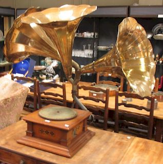 An early 20th century walnut cased Continental gramophone with three brass horns and various LP reco
