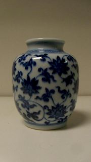A Ming style blue and white vase, a band of tendrils on the shoulders above scrolling lotus on the s