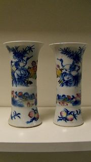 A pair of famille rose vases, the gu shapes painted with cranes, mandarin ducks,chrysanthemums, lotu