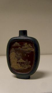 A Yixing blue snuff bottle, the red/brown recessed panels to each side of the flattened ovoid shape