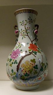 A famille rose vase, six character mark of Guangxu, two peach handles applied to the waisted neck be