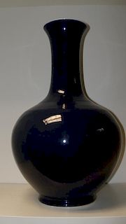 A blue glazed bottle vase, six character mark of Guangxu, the flared rim, slender cylindrical neck a
