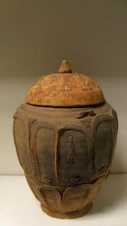 A 10th/11th century Yunnan Buddhist jar and cover, the ovoid sides moulded with two bands of lotus p