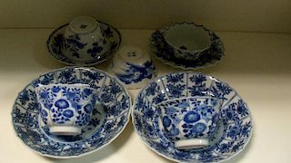 A collection of nine 18th century blue and white tea wares, the earlier wares painted with flowers o