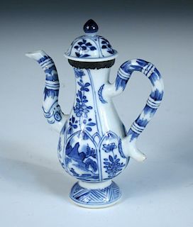 A miniature blue and white ewer and cover, period of Kangxi, the handle and spout of the baluster sh