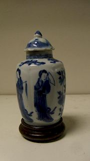 A blue and white jar, period of Kangxi, with a later cover and a wood stand, the lobes of the rounde
