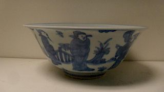 A blue and white bowl bearing six character mark of Wanli, the exterior painted with dignitaries and