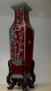 A 19th century sang du boeuf square sectional vase, painted on two sides with cherry trees flowering