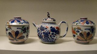 An 18th century Imari tea pot, a pair of Japanese Imari bowls and covers, the compressed spherical b