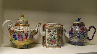 Two Canton tea pots, one cover and a Japanese imari tea pot and cover, one tea pit painted with a co