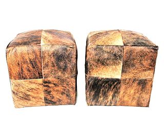 PAIR OF STITCHED COWHIDE POUF OTTOMANS