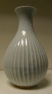 A yingqing glazed vase, possibly Korean, the lanceolate leaves incised below the flared rim above fl
