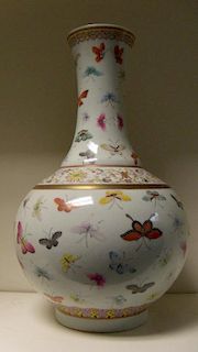 A 19th century famille rose bottle vase, six character mark of Guangxu, ruyi lappets in a band on th
