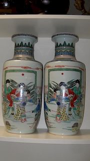 A pair of Kangxi style famille verte vases, each painted with ladies on a terrace and before a scree