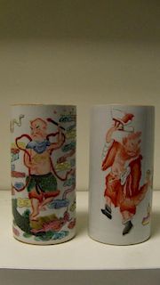 Two late 19th century brush pots, one of the cylindrical sides painted in iron red with Zhong Kui da