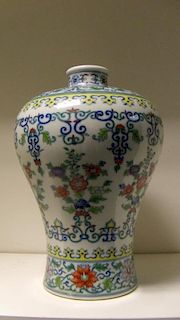 A wucai meiping vase, six character mark of Yongzheng, scrolling flowers on the shoulders above a ba
