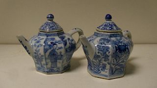 Two blue and white tea pots, period of Kangxi, each of octagonal shape and painted with panels of fl