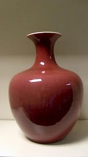 A 19th century sang du boeuf vase, the waisted neck and broad shoulders over a hemispherical body ev