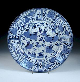 A late 17th/early 18th century blue and white 'kraak' dish, the central floral roundel enclosed by a