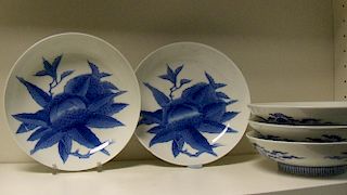Five Nabeshima style blue and white dishes, each painted with sweet chestnuts developing amongst the