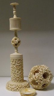 A late 19th/early 20th century ivory ball within ball carving and stand, the exterior of the ball ca