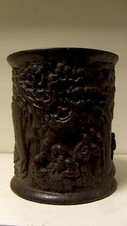 A hardwood brush pot, the exterior carved in relief with two riders approaching go player beneath pi