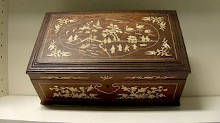 A late 19th/early 20th century bone inlaid box, the hinged rectangular lid with figures about a gard