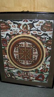 A Tibetan tangkha painted with the wheel of life enclosed by monks and other figures on clouds, 58 x
