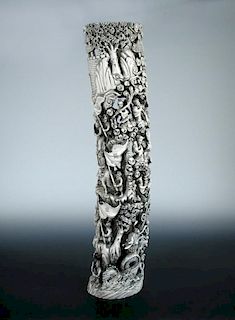 An early 20th century ivory tusk pierced and carved on one side with a dragon and the eight Daoist i
