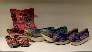 Four pairs of late 19th century embroidered shoes, two pairs raised on stiffened cotton and leather