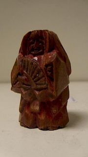 A Nara ningyo ittabori netsuke depicting a Noh actor standing holding a fan, the soft wood painted p