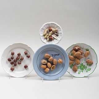 Group of Four Trompe L'Oeil Ceramic Models of Nuts on Plates