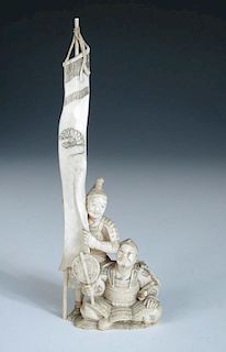A late 19th/early 20th century ivory military group carved as a banner bearer standing over a fully