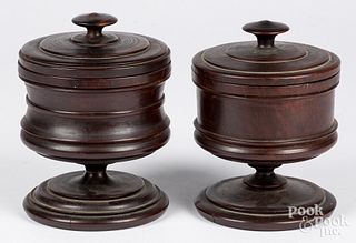 Two lignum vitae turned lidded canisters, 19th c.