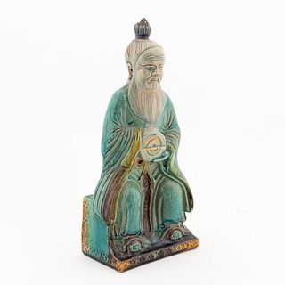 CHINESE TURQUOISE SEATED CERAMIC IMMORTAL FIGURE