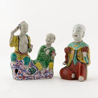 TWO CHINESE EXPORT FAMILLE ROSE BOY FIGURINES