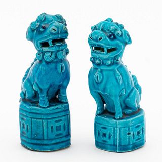 SMALL PAIR OF PEACOCK-BLUE CERAMIC BUDDHIST LIONS
