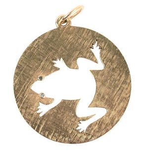 14 Karat Gold Pendant, having cut out frog with diamond eyes, diameter 1 3/8 inches, 12.6 grams.