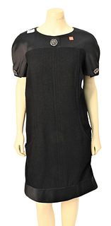 Chanel Silk and Wool Dress, black, short sleeve with front pockets, scoop neck, black silk trim and jeweled buttons, size 44/12, condition consistent 