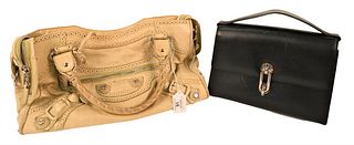 Two Balenciaga Handbags, one having black and white leather, single compartment, leather lined with one zip and two slip pockets, gold tone hardware, 