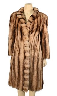 Vintage Fur Knee Length Coat, possibly raccoon, having side slip pockets, stand up collar and front fur trim, fur is stiff from age, not split, size s
